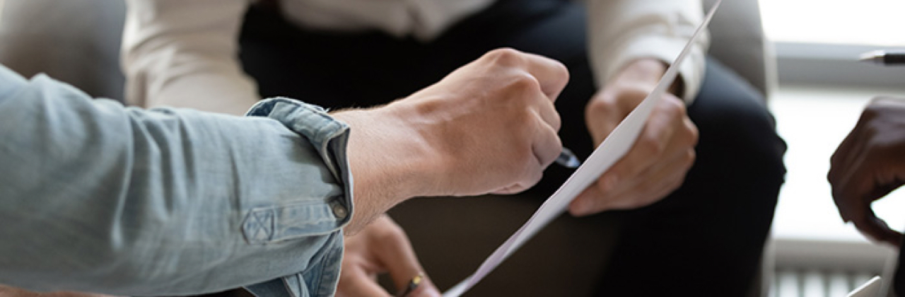 Man reviewing bankruptcy paperwork with a Licensed Insolvency Trustee
